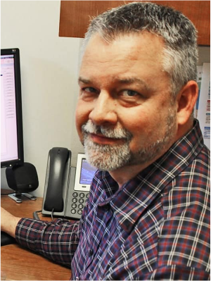 Randall Johnson working at his desk