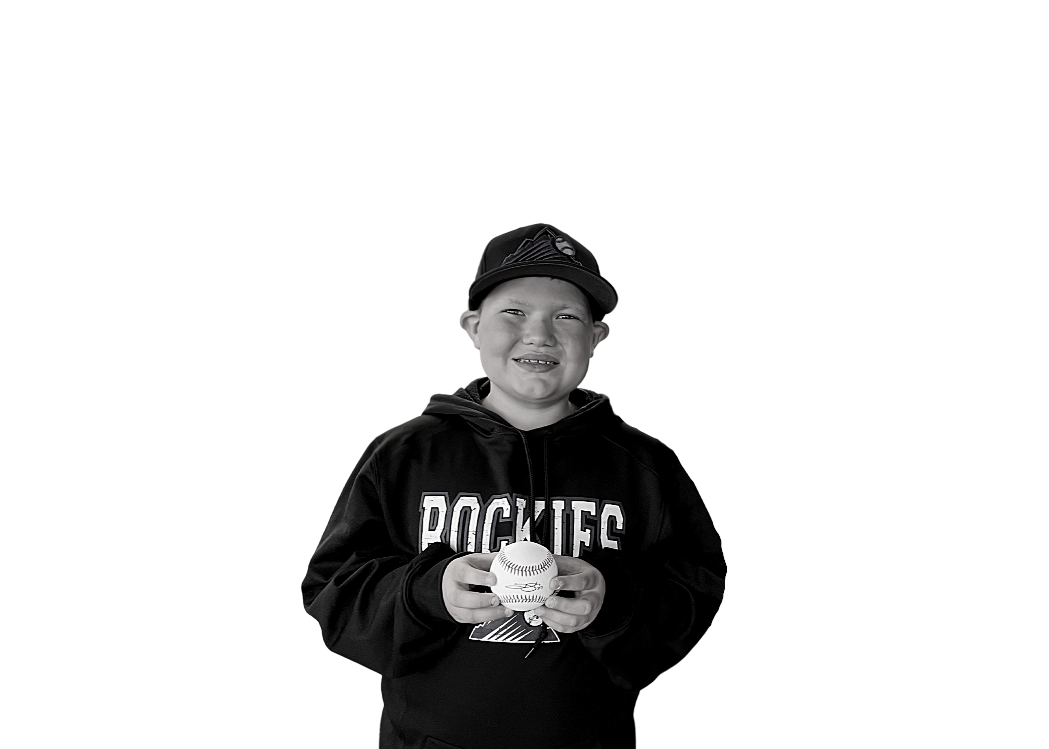 Corbin holding a baseball and smiling