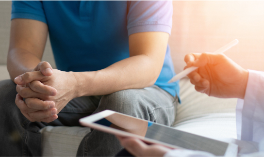 Doctor on Tablet with Patient